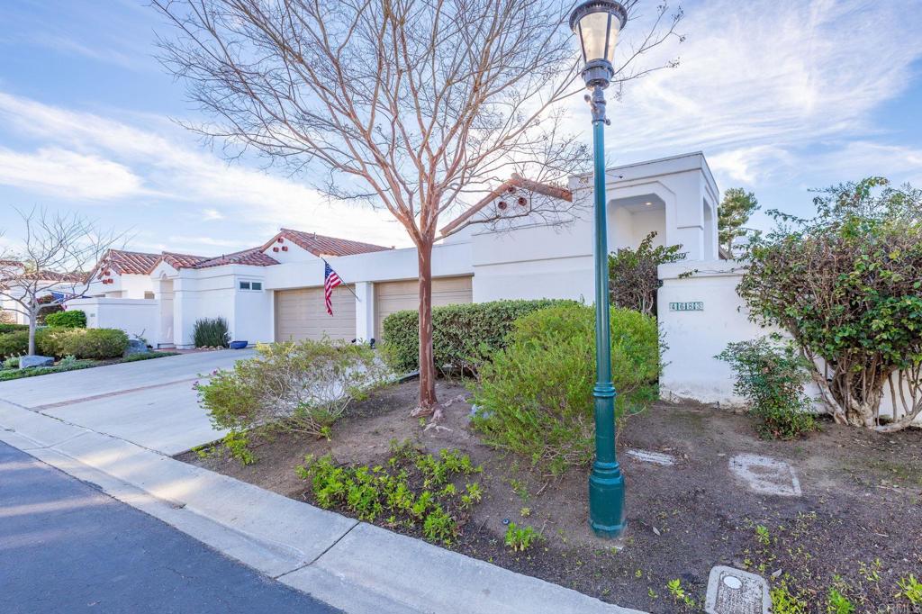 4683 Majorca Way Oceanside, CA 92056 - Photo 5 of 55 a front view of a house with garden