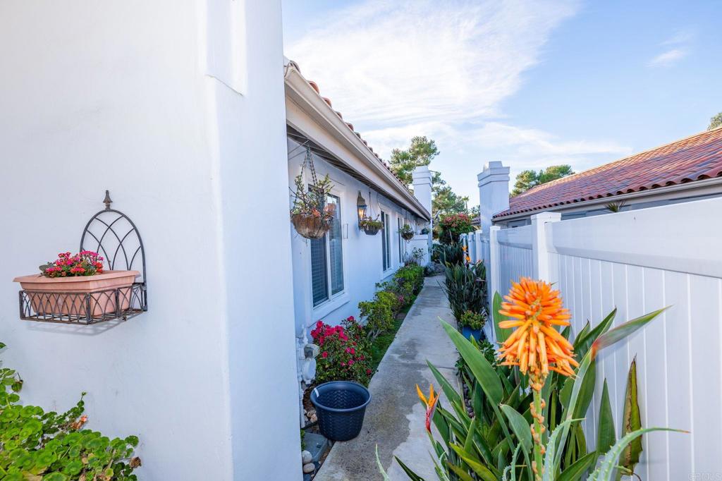 4683 Majorca Way Oceanside, CA 92056 - Photo 6 of 55 a vase with flowers sitting on a floor in front of a house