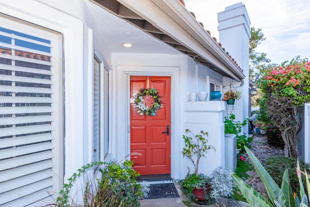 4683 Majorca Way Oceanside, CA 92056 - Photo 7 of 55 a front view of a house with potted plants