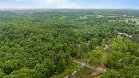 an aerial view of residential houses with outdoor and green space