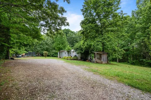 a view of a house with a back yard
