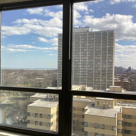 a view of a balcony with a floor to ceiling window