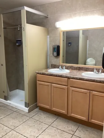 a living room with a couch and a fireplace