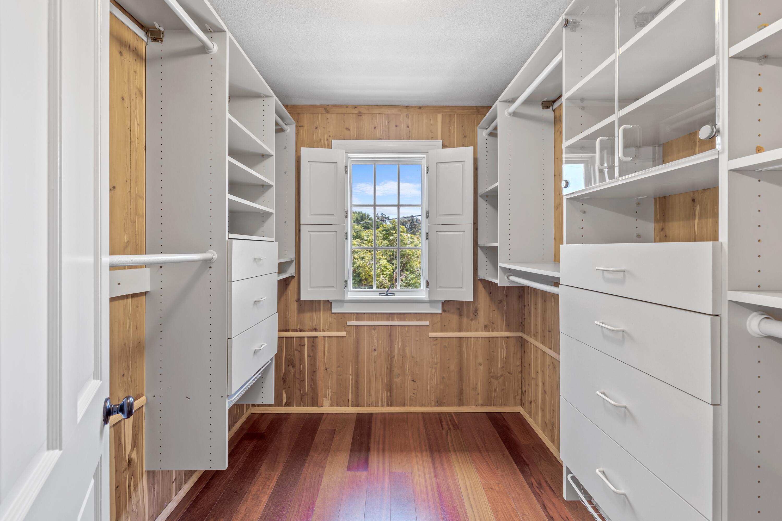 1284 Spring Road Santa Barbara, CA 93108 - Photo 16 of 33 a view of walk in closet with wooden floor and door