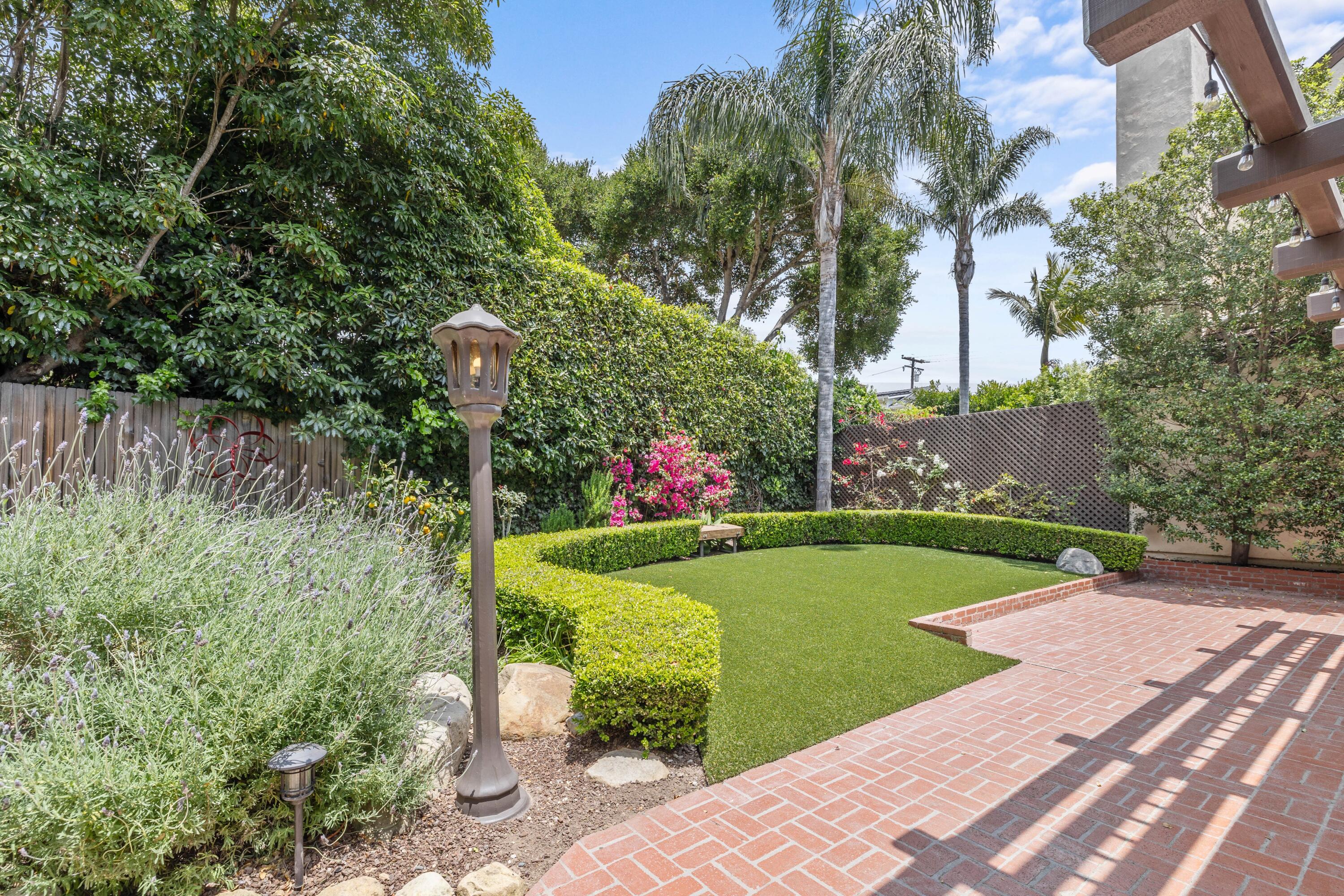 1284 Spring Road Santa Barbara, CA 93108 - Photo 20 of 33 a view of a table and chairs in the garden