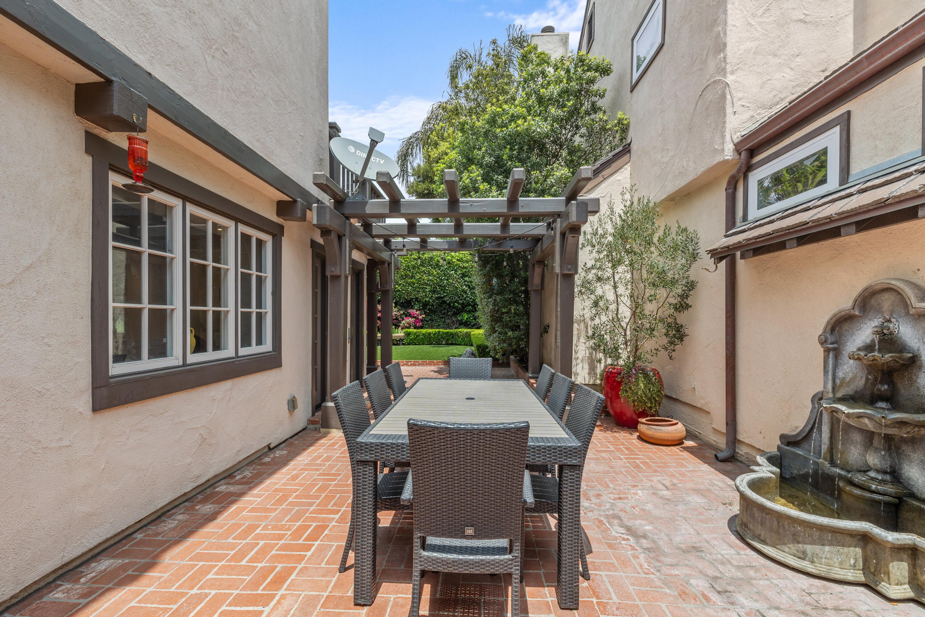 1284 Spring Road Santa Barbara, CA 93108 - Photo 22 of 33 a table and chairs in front of a building