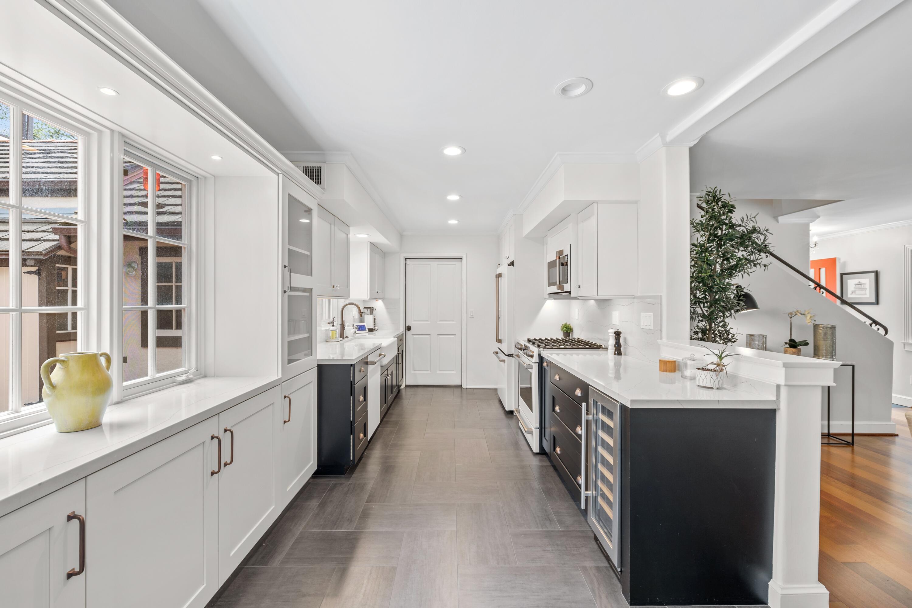 1284 Spring Road Santa Barbara, CA 93108 - Photo 5 of 33 a large white kitchen with a large window