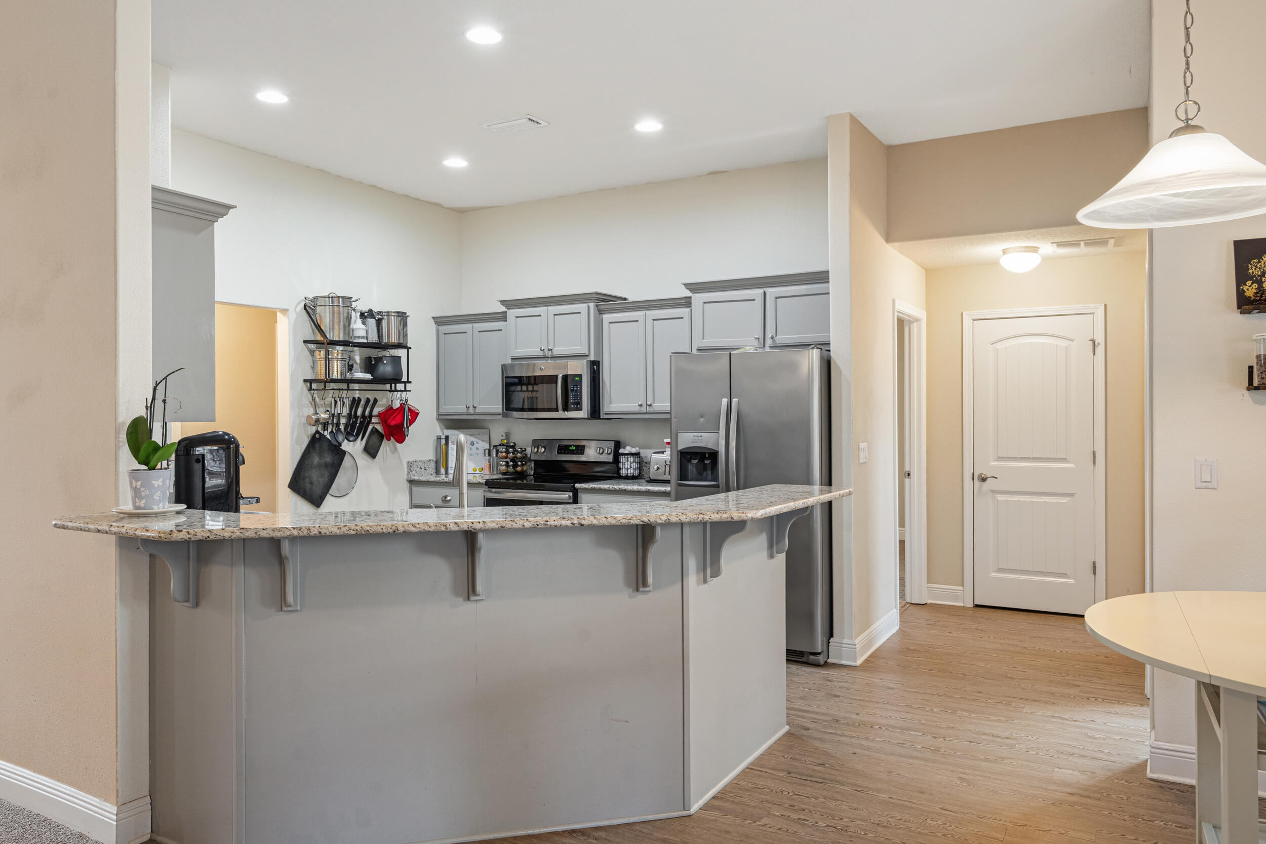 2345 Genevieve Way Crestview, FL 32536 - Photo 11 of 41 a kitchen with stainless steel appliances a sink stove and refrigerator