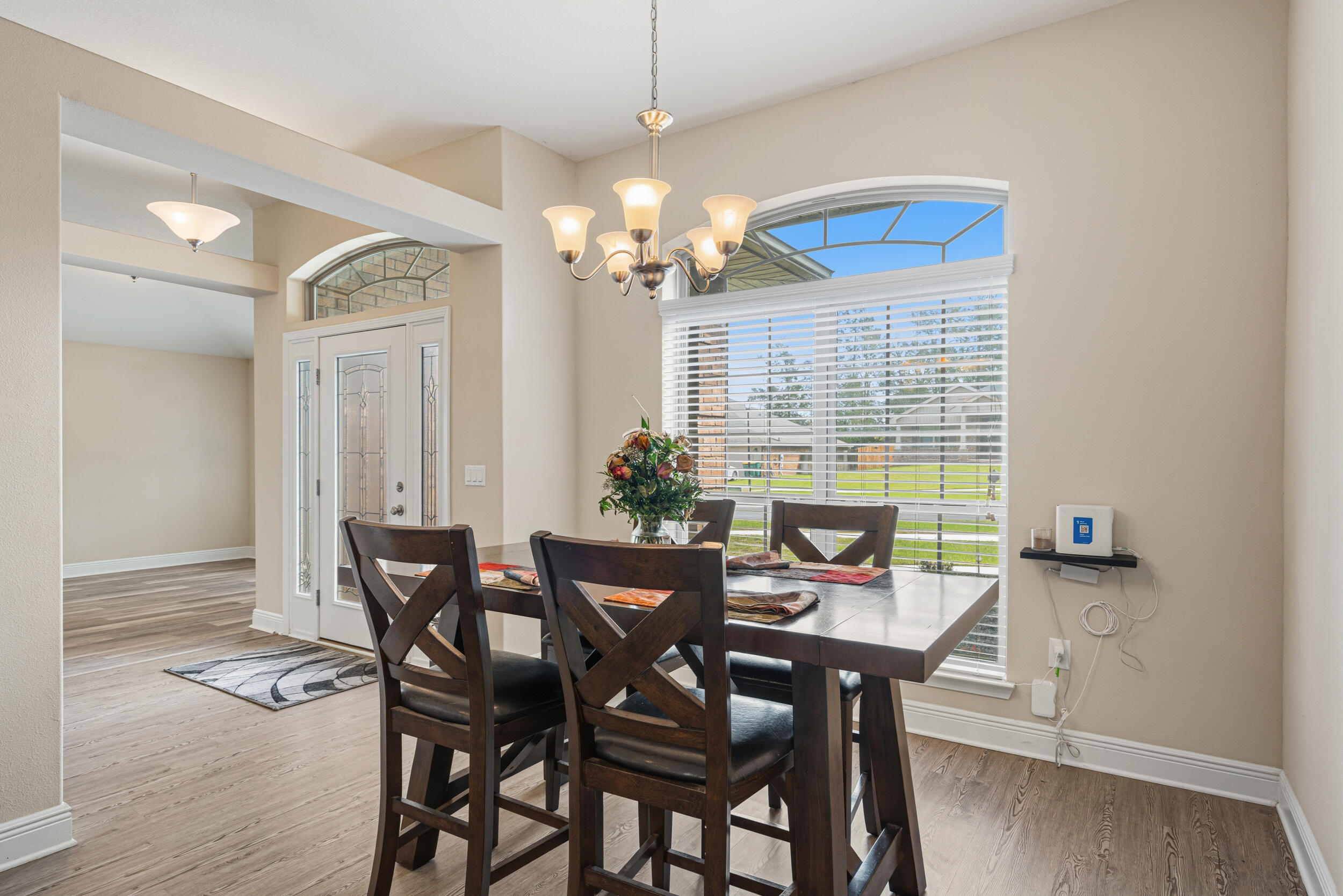 2345 Genevieve Way Crestview, FL 32536 - Photo 13 of 41 a view of a dining room with furniture and wooden floor