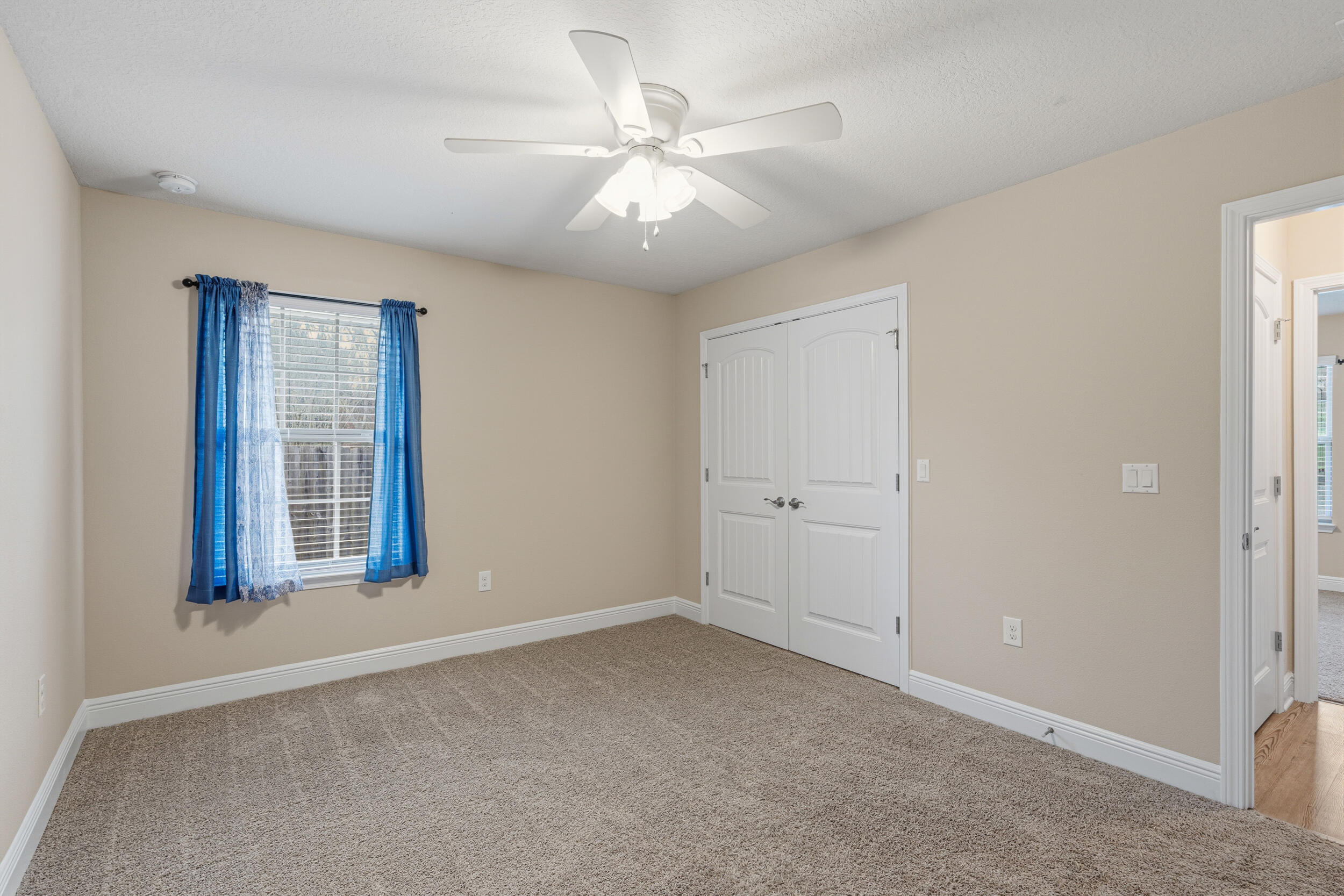 2345 Genevieve Way Crestview, FL 32536 - Photo 17 of 41 a view of an empty room with chandelier fan and fire place