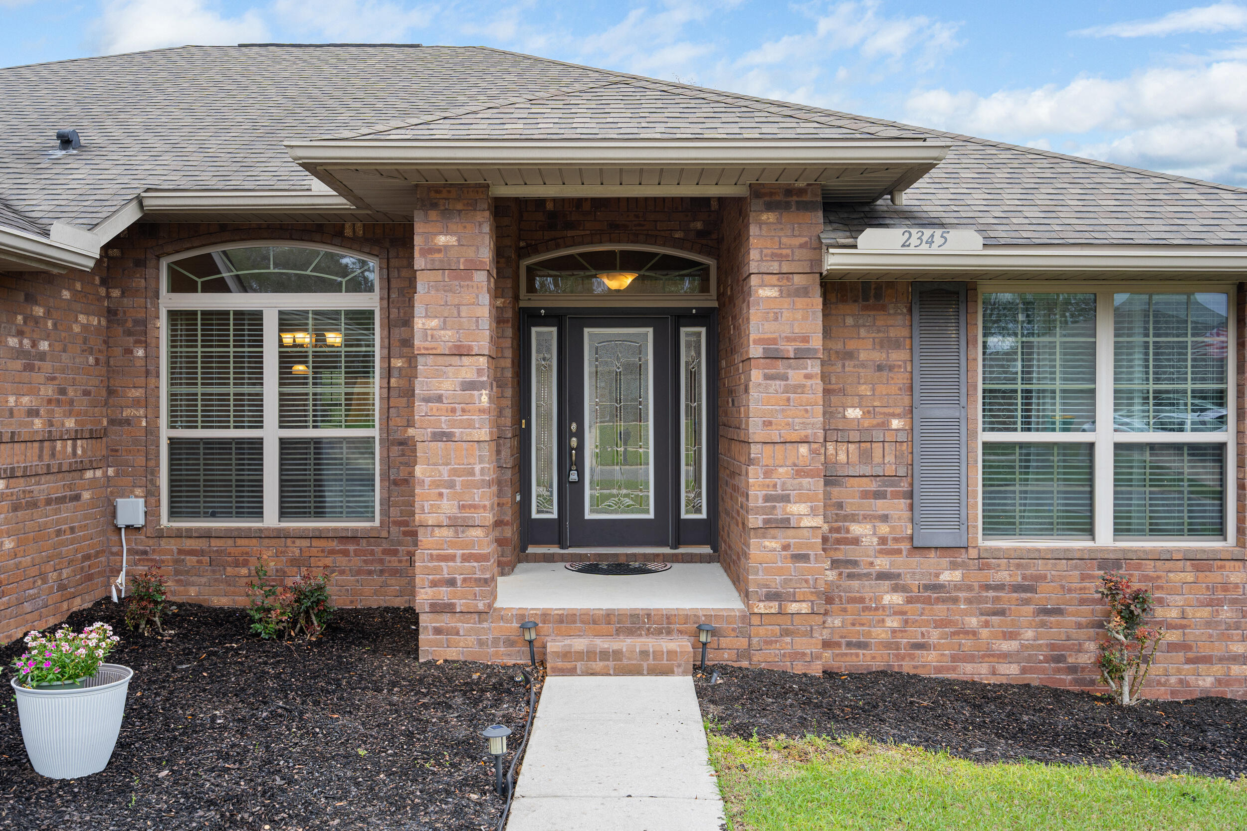 2345 Genevieve Way Crestview, FL 32536 - Photo 34 of 41 a front view of a house with a porch