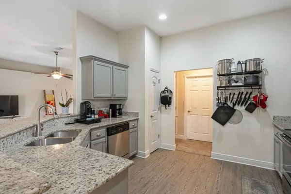 a kitchen with a sink cabinets and window