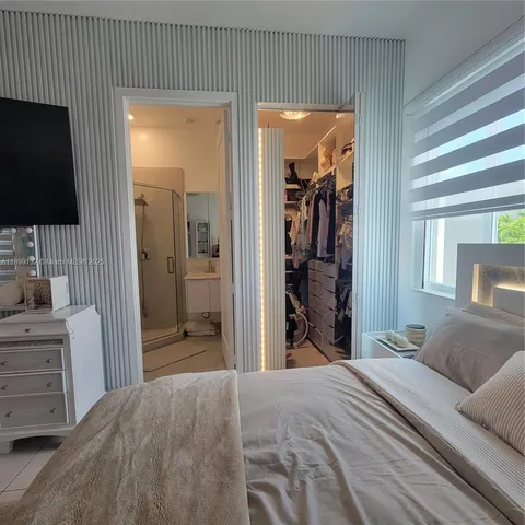 a bedroom with furniture and a bed