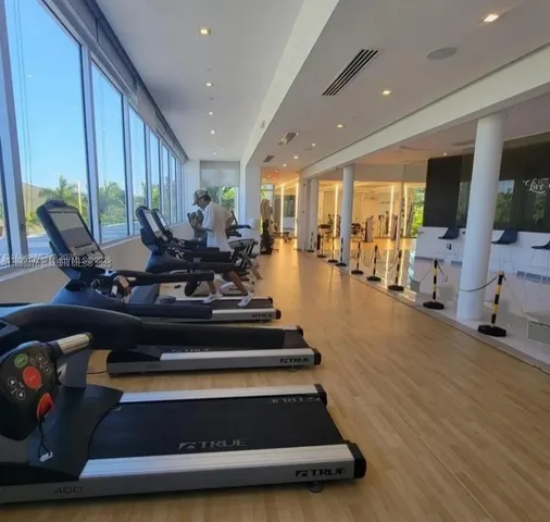 a building with a palm tree in front of it