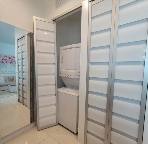 a bathroom with a shower and closet