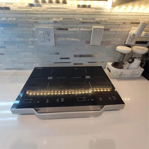 a kitchen with a sink and a refrigerator