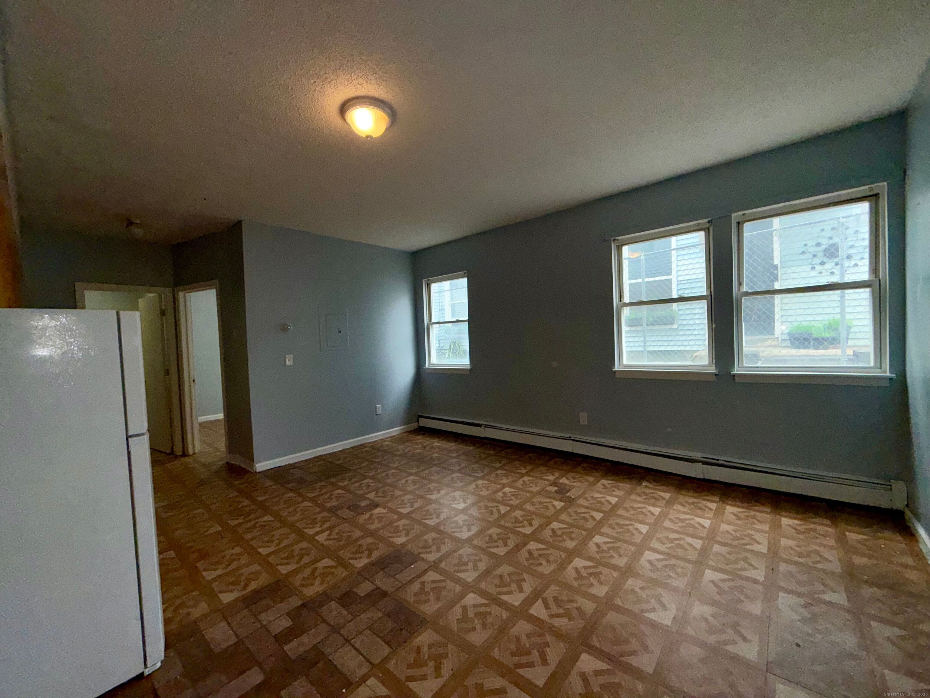 132 Locust Street, Unit 4 Waterbury, CT 06704 - Photo 2 of 8 a view of an empty room and window