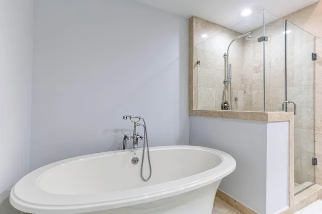 a white bath tub sitting in a bathroom