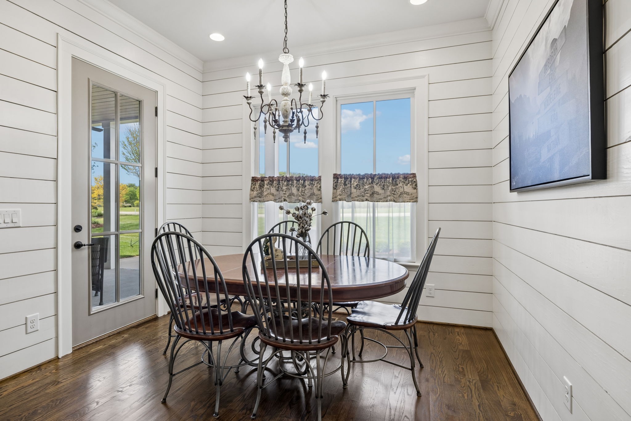 6033 Native Pony Trail College Grove, TN 37046 - Photo 39 of 87 a view of a dining room with furniture wooden floor and chandelier