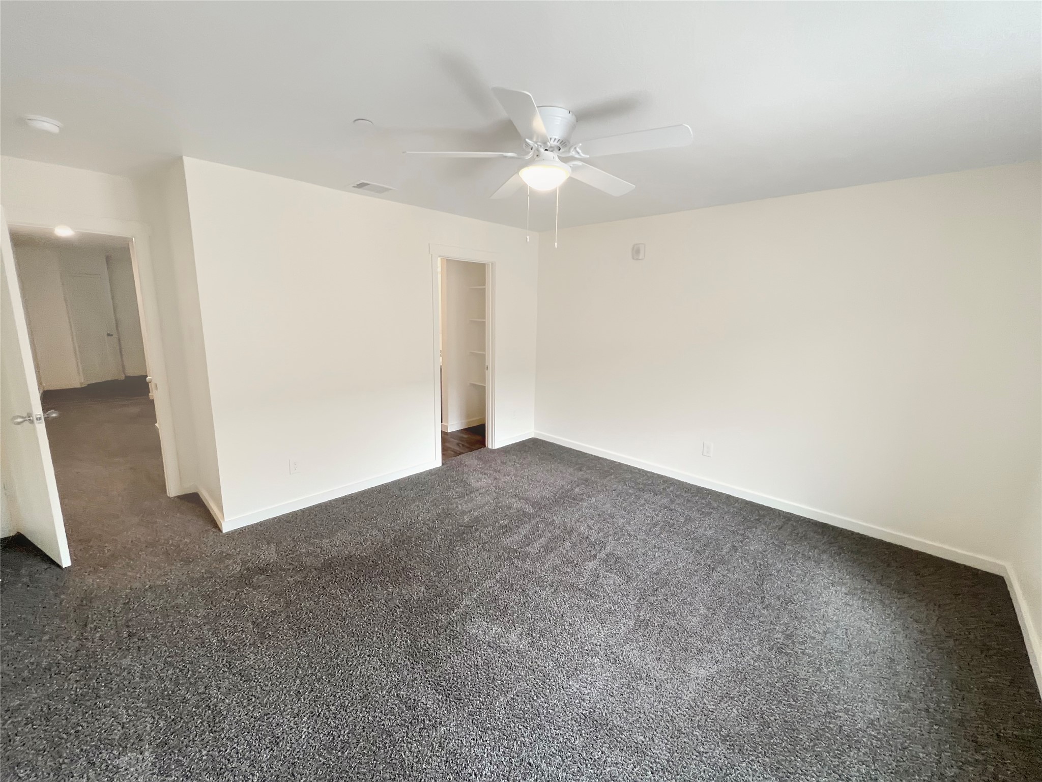 21155 Gosling Road, Unit 48 AD Spring, TX 77388 - Photo 15 of 20 an empty room with a ceiling fan and a bathroom