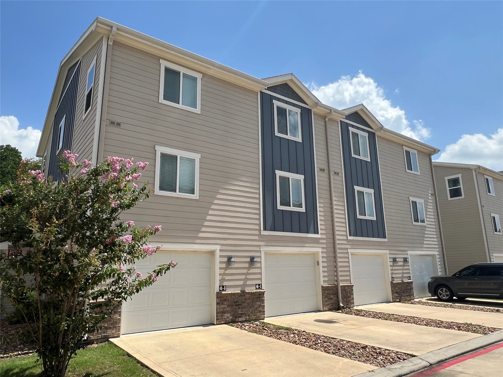 21155 Gosling Road, Unit 48 AD Spring, TX 77388 - Photo 4 of 20 a front view of a house with a yard