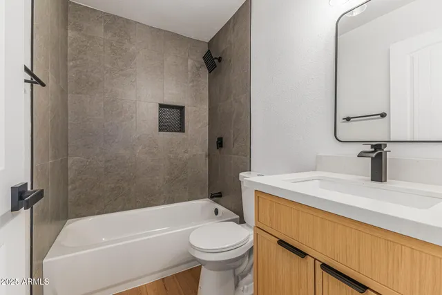 a bathroom with a sink a toilet and a bathtub