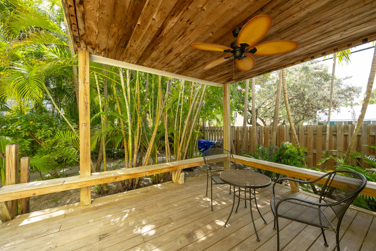804 South Street, Unit 2 Key West, FL 33040 - Photo 12 of 17 a patio with a yard table and chairs