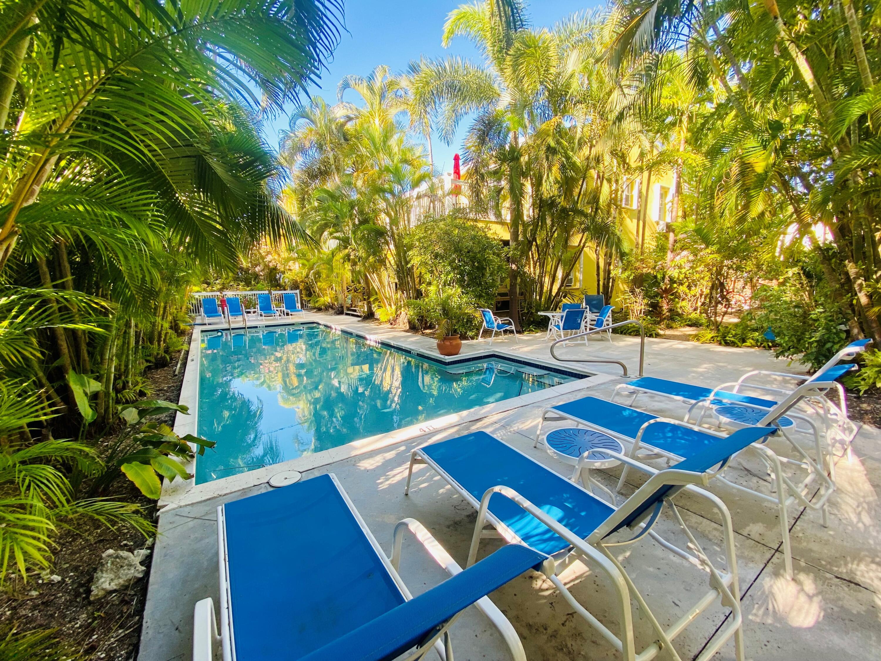 804 South Street, Unit 2 Key West, FL 33040 - Photo 15 of 17 a view of backyard with swimming pool and outdoor seating