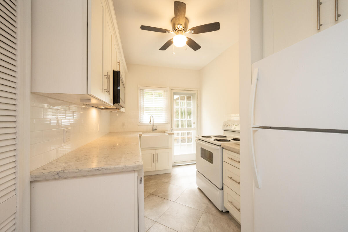 804 South Street, Unit 2 Key West, FL 33040 - Photo 3 of 17 a kitchen with a stove a refrigerator and a sink
