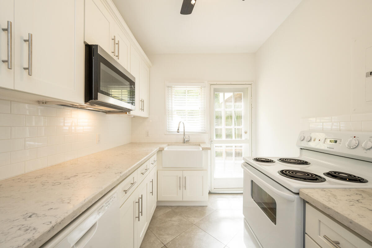804 South Street, Unit 2 Key West, FL 33040 - Photo 4 of 17 a kitchen that has a sink and a stove