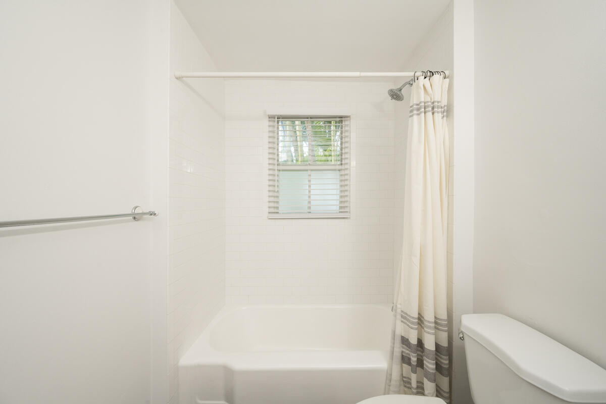 804 South Street, Unit 2 Key West, FL 33040 - Photo 6 of 17 a bathroom with a bathtub and a shower