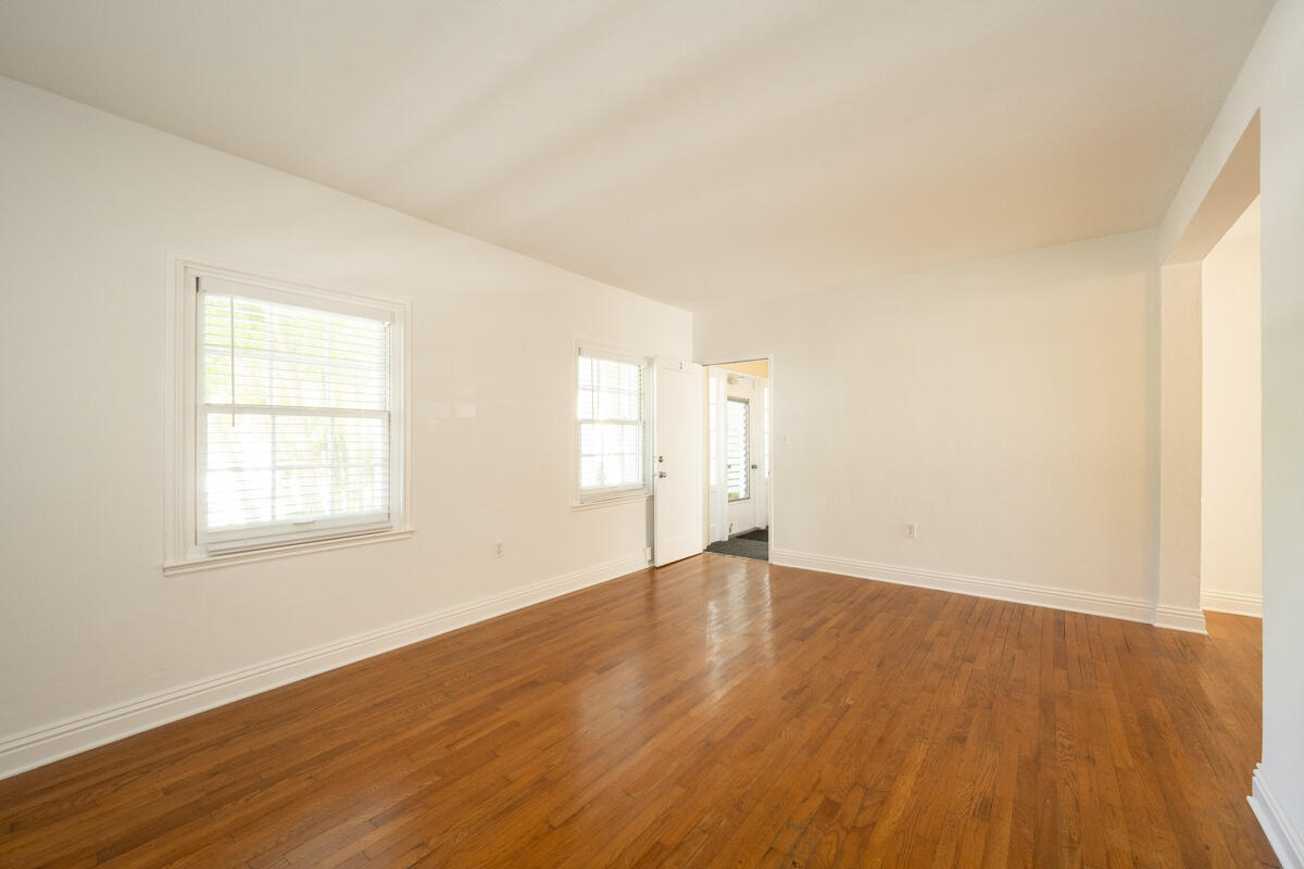 804 South Street, Unit 2 Key West, FL 33040 - Photo 7 of 17 an empty room with wooden floor and windows