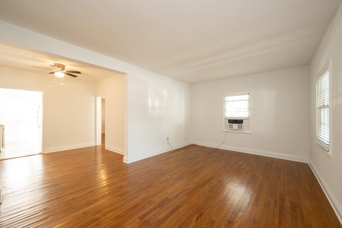 804 South Street, Unit 2 Key West, FL 33040 - Photo 8 of 17 an empty room with wooden floor and windows