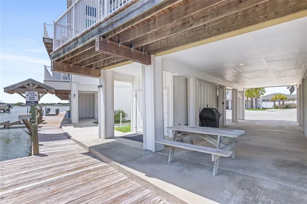 a view of a chairs and table in a patio