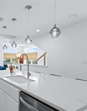 a kitchen with a sink and a refrigerator
