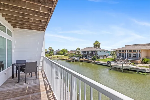 a view of residential house with outdoor space and seating