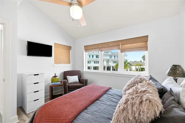 a bed room with a bed and a chair