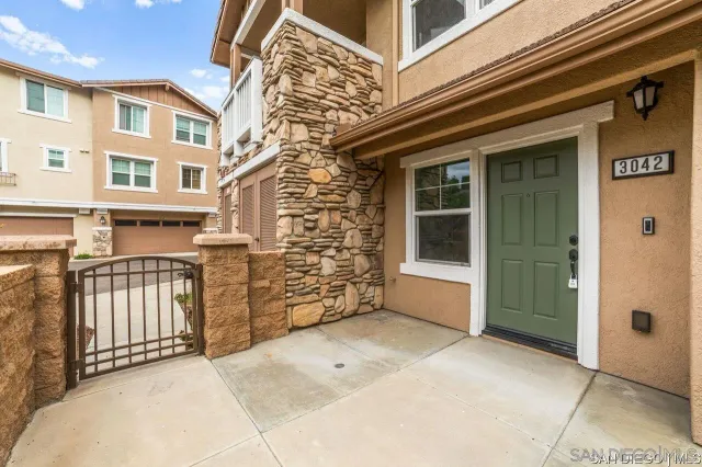 a view of a brick house with a large window