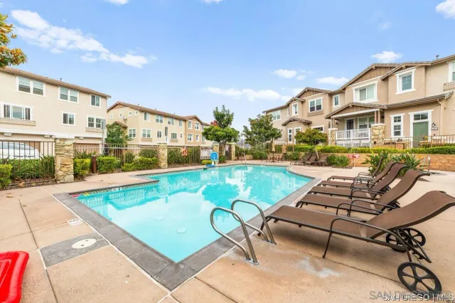 a view of a white building with many windows