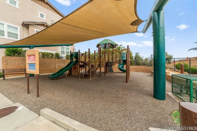 a view of a patio with table and chairs and potted plants