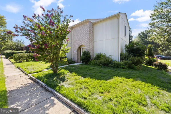 a backyard of a house with a garden and plants