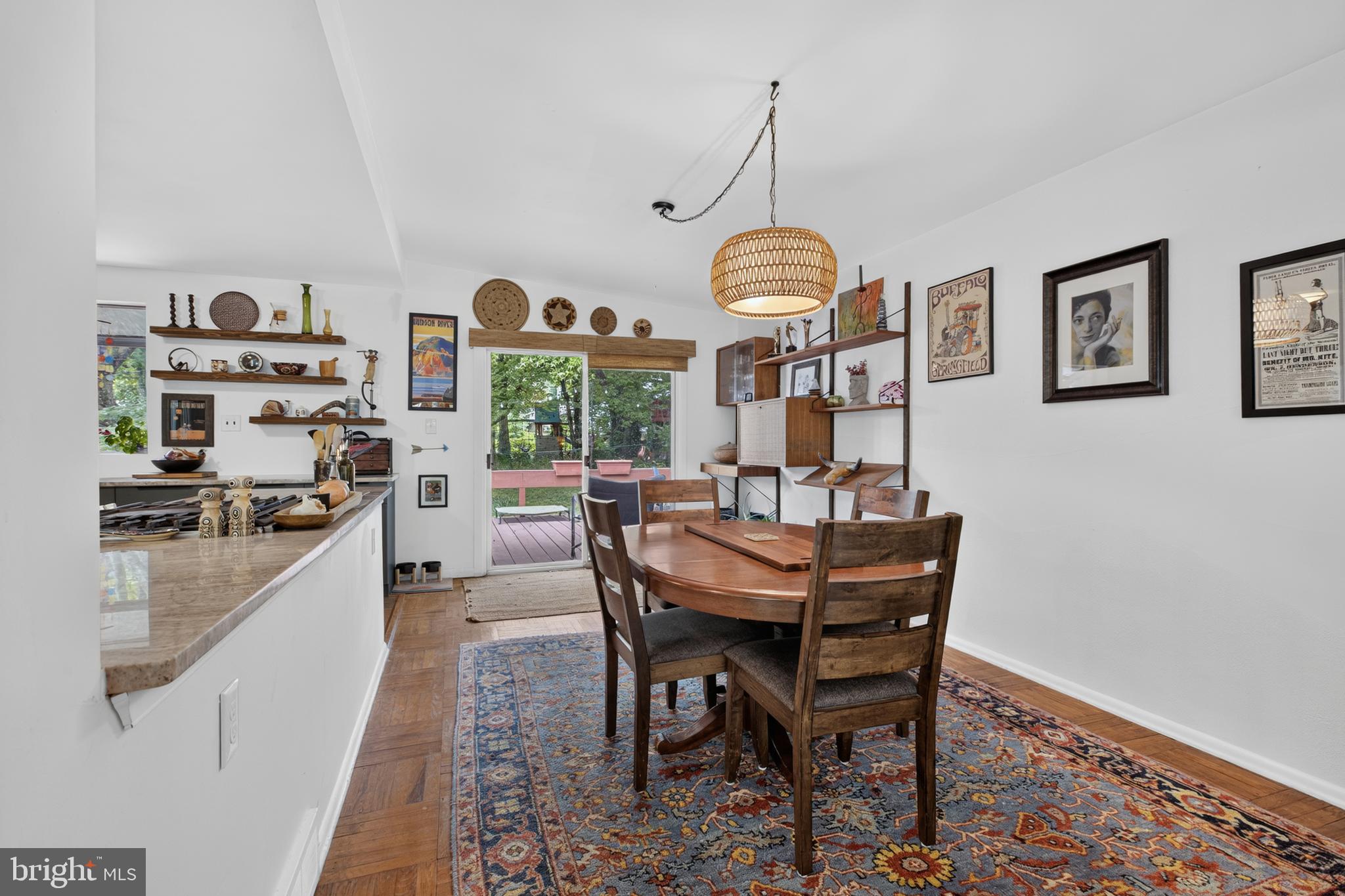 1402 Drake Road Wilmington, DE 19803 - Photo 22 of 57 a dining room with furniture a chandelier and wooden floor