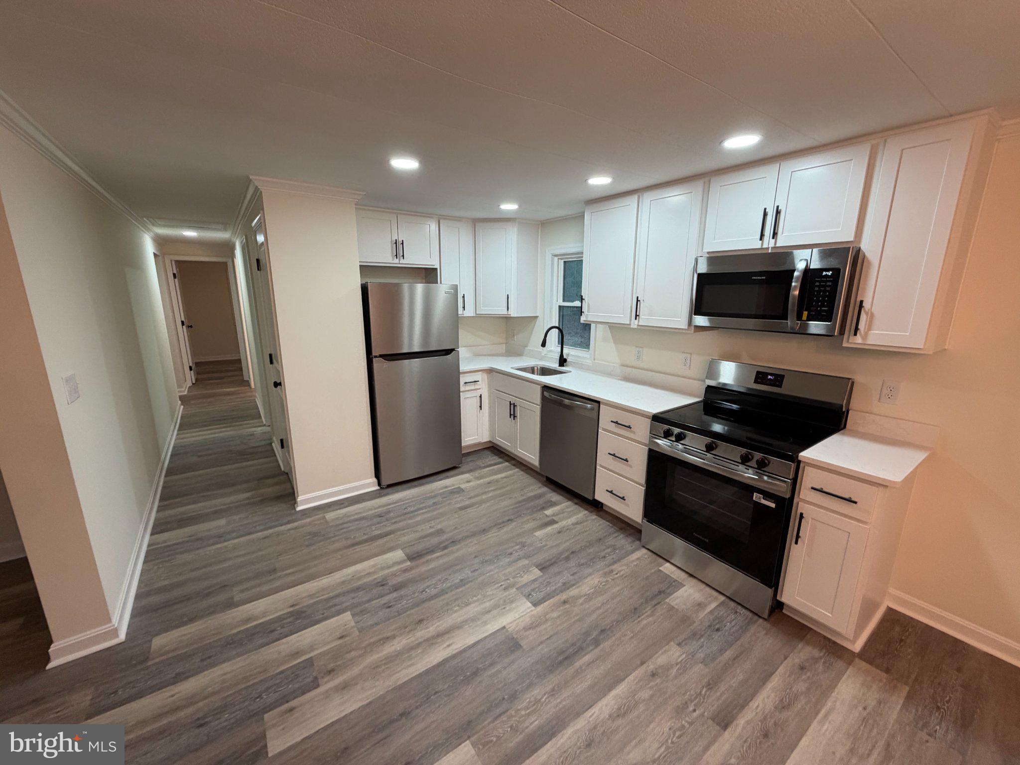 22206 Wetipquin Road Quantico, MD 21856 - Photo 14 of 19 Modern kitchen with sleek finishes.