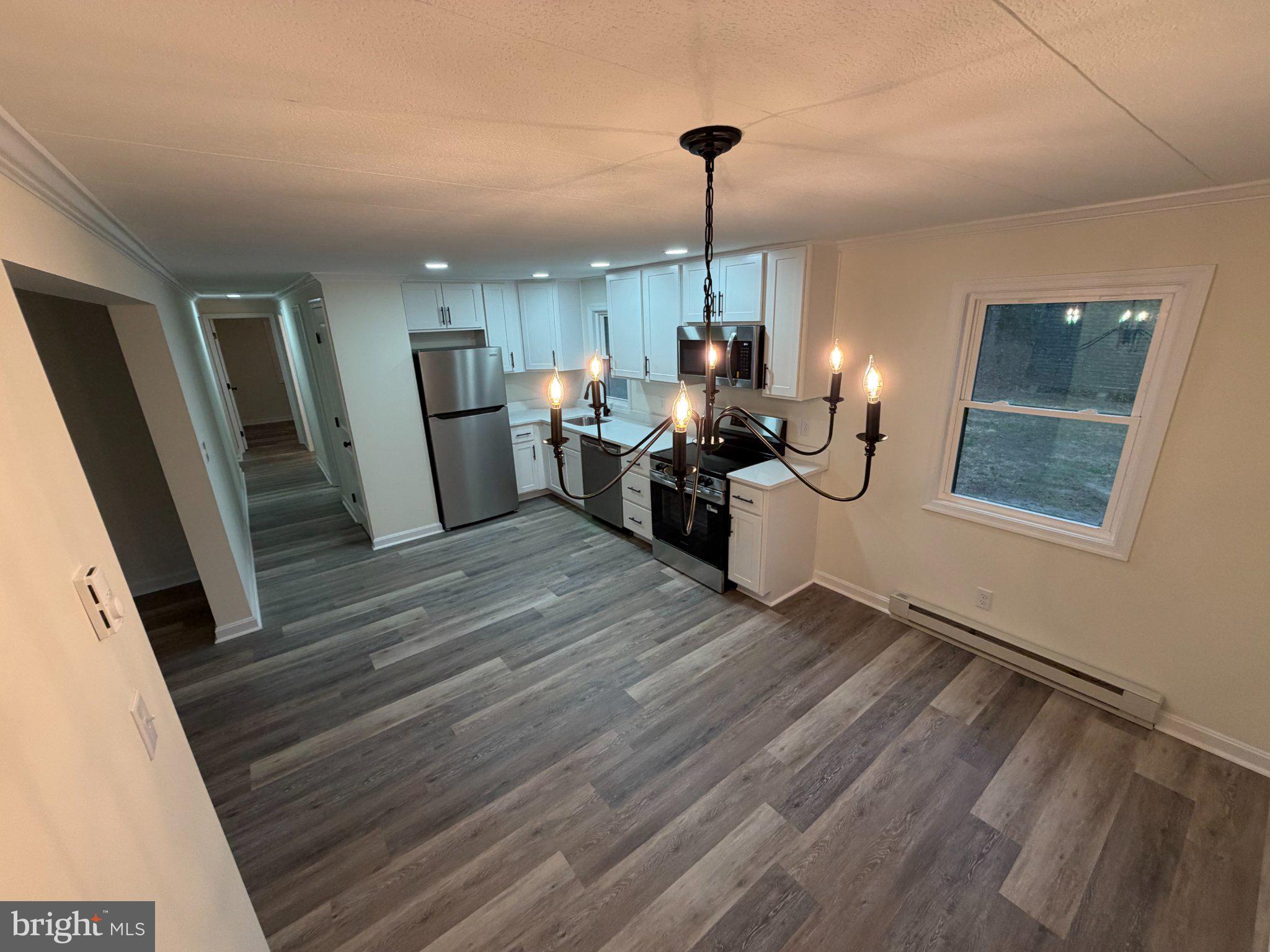 22206 Wetipquin Road Quantico, MD 21856 - Photo 18 of 19 Modern kitchen with elegant lighting.