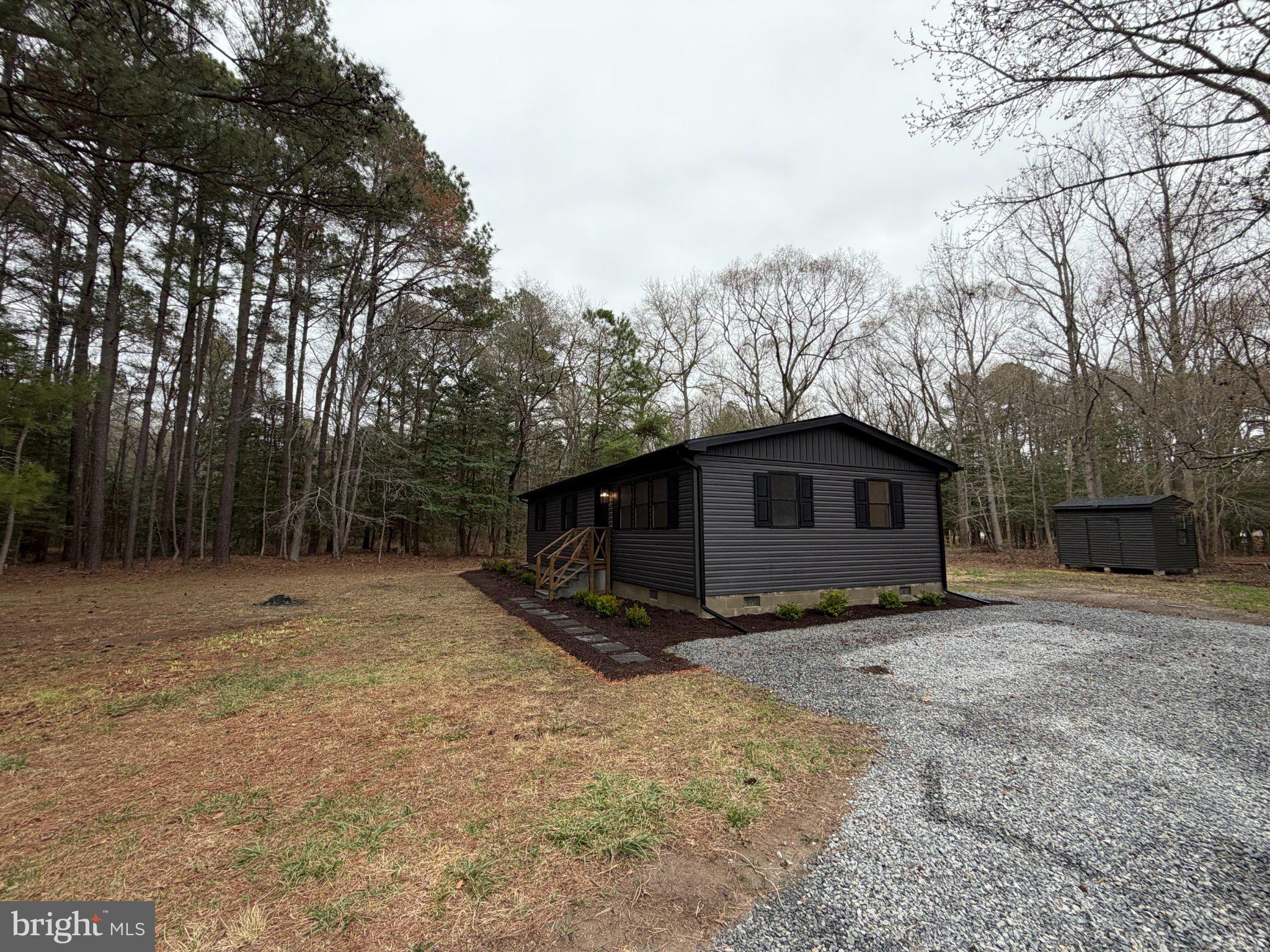 22206 Wetipquin Road Quantico, MD 21856 - Photo 4 of 19 Charming black cottage in serene woods.