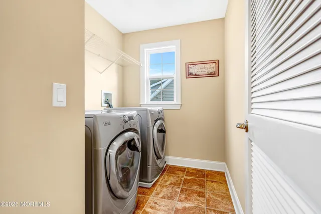 a bathroom with a sink and a large mirror
