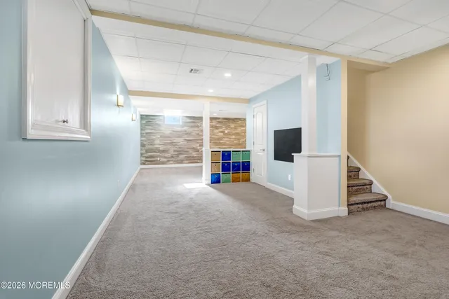 a view of an empty room with storage