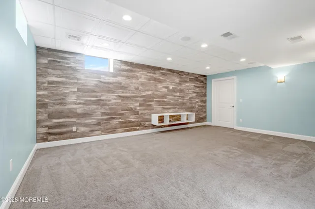 a view of a garden with a house