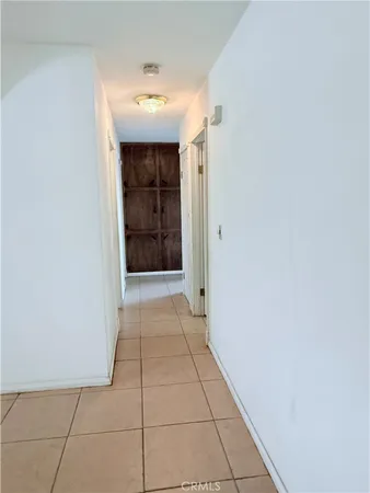 a spacious bathroom with a double vanity sink toilet and a mirror
