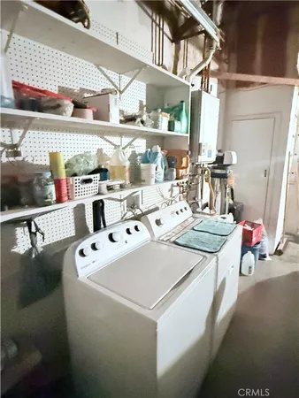 a view of a dirt road with a building in the background